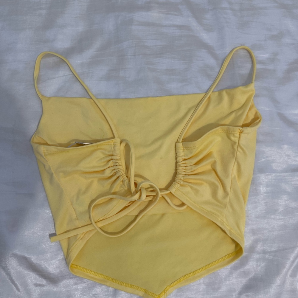 Spaghetti strap yellow top with open back.